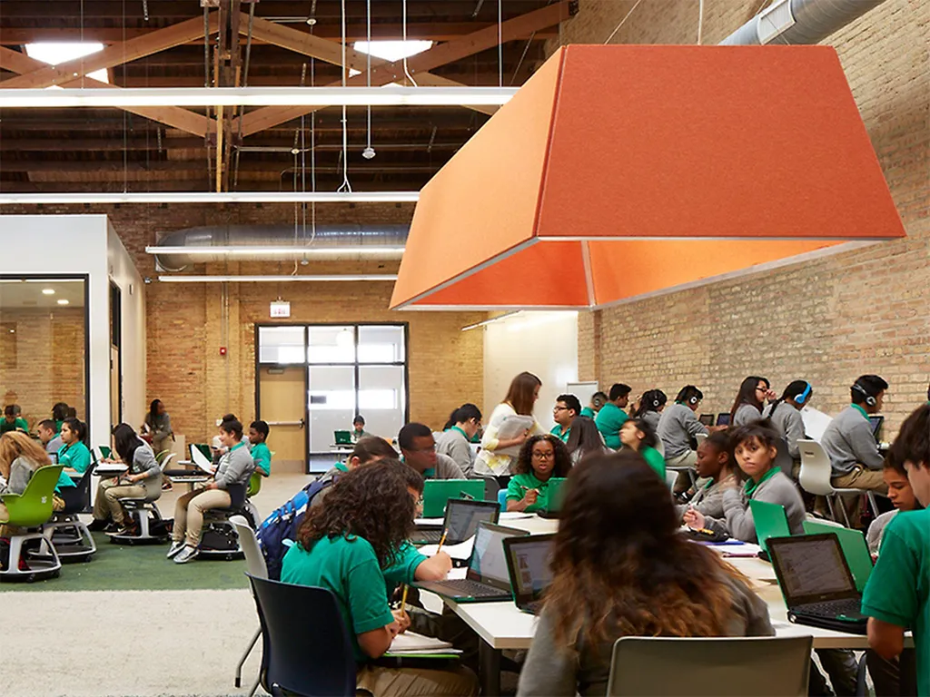 Custom cut PET Panels | Color: Orange | Installed at the Intrinsic Schools Belmont Campus in Chicago, IL
